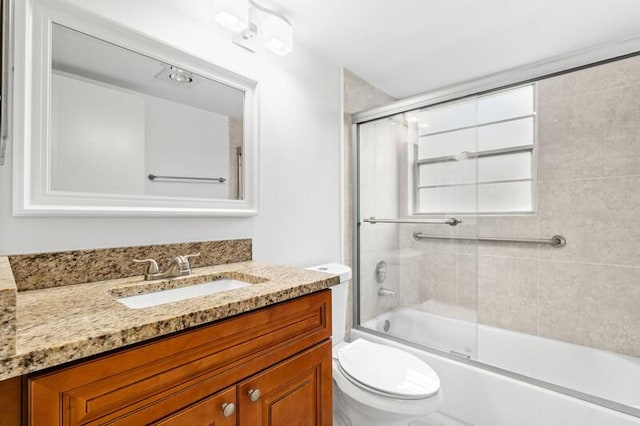 556 Mansfield N, Boca Raton, FL 33434 - bathroom with toilet, vanity, and bath / shower combo with glass door