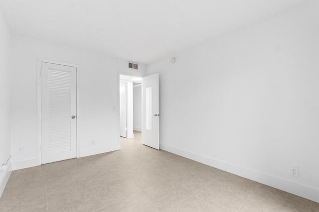 556 Mansfield N, Boca Raton, FL 33434 - empty room with baseboards