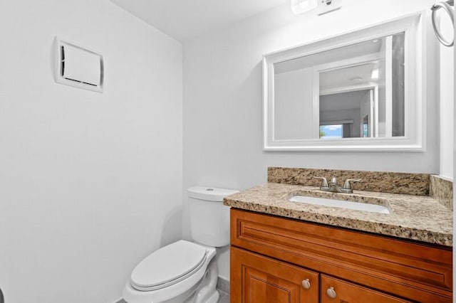 556 Mansfield N, Boca Raton, FL 33434 - bathroom with vanity, toilet, and baseboards
