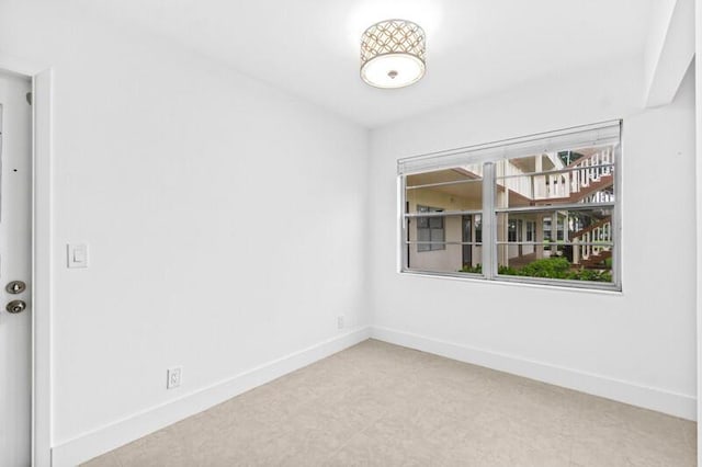 556 Mansfield N, Boca Raton, FL 33434 - empty room featuring baseboards