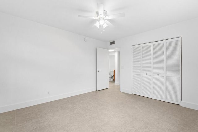 556 Mansfield N, Boca Raton, FL 33434 - unfurnished bedroom featuring a closet, baseboards, and a ceiling fan