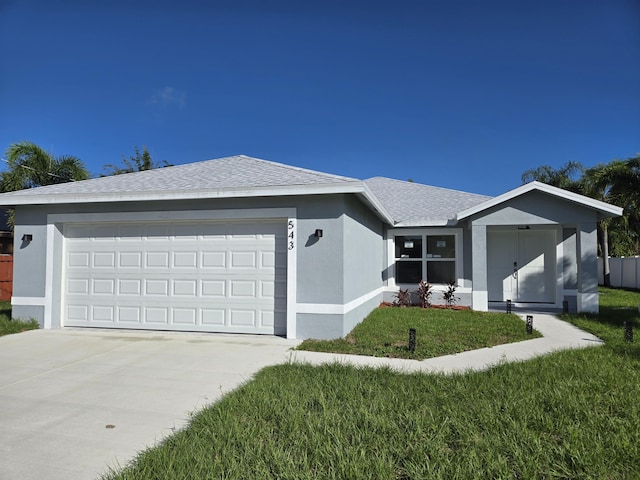 ranch-style home with a front lawn, roof with shingles, stucco siding, and driveway