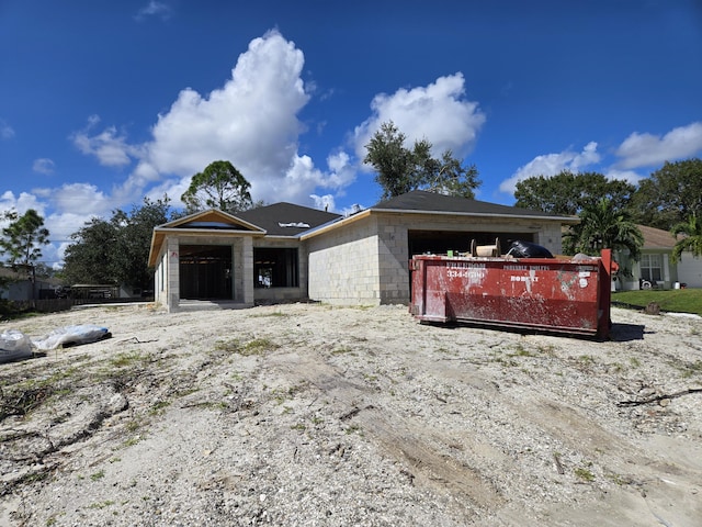view of front of house with concrete block siding