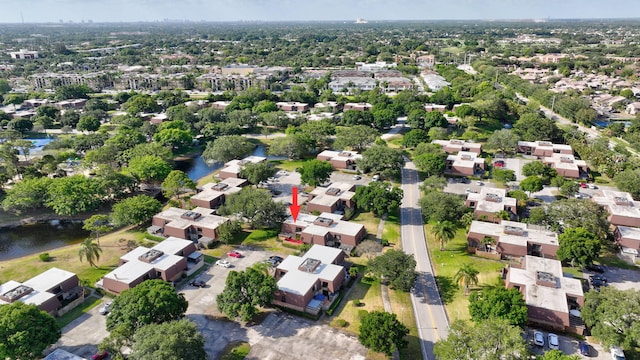 bird's eye view with a water view and a residential view