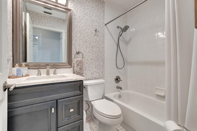 bathroom featuring tile walls, shower / tub combo, vanity, tile patterned floors, and toilet