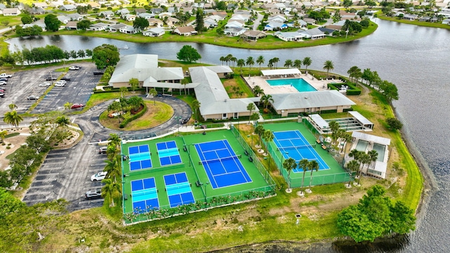 drone / aerial view featuring a residential view and a water view