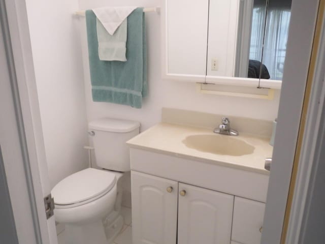 bathroom with toilet and vanity