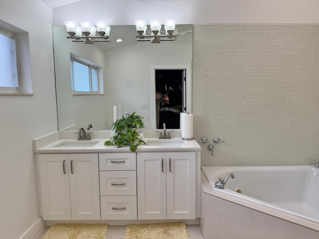 5534 Ainsley Ct, Boynton Beach, FL 33437 - bathroom featuring a chandelier, a tub with jets, and double vanity
