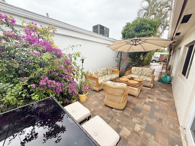 5534 Ainsley Ct, Boynton Beach, FL 33437 - view of patio / terrace featuring an outdoor hangout area and central AC unit