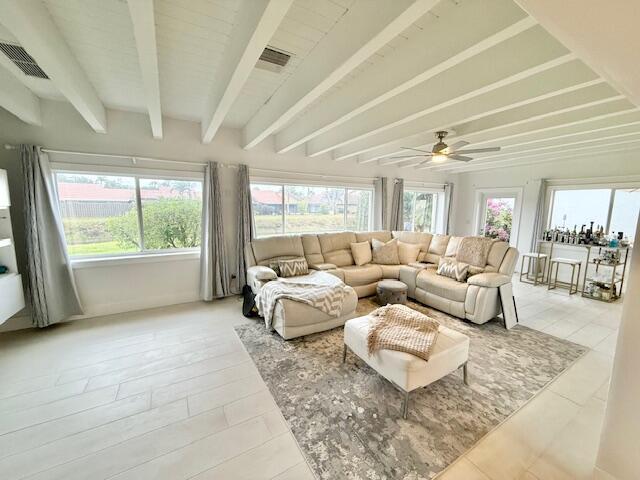 5534 Ainsley Ct, Boynton Beach, FL 33437 - living area featuring healthy amount of natural light, beam ceiling, and a ceiling fan
