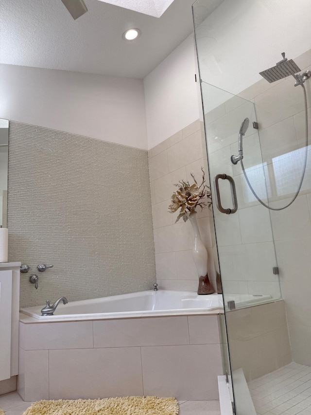 5534 Ainsley Ct, Boynton Beach, FL 33437 - full bath featuring a shower stall, a bath, tile patterned floors, recessed lighting, and tile walls