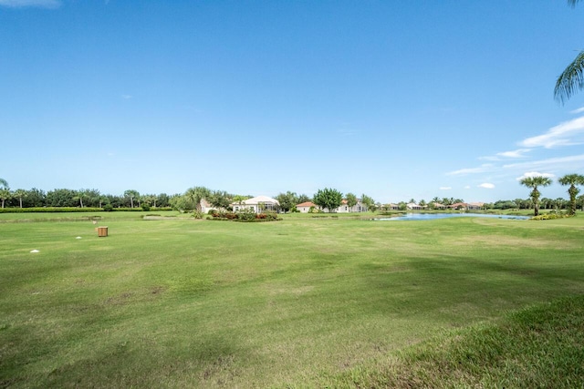 307 NW Clearview Ct, Port Saint Lucie, FL 34986 - view of community with a water view, a lawn, and view of golf course