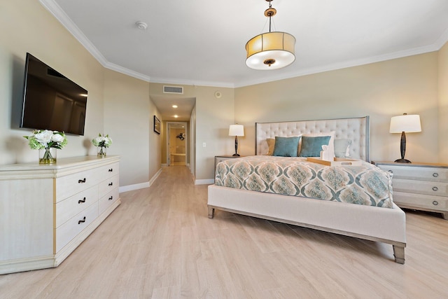 bedroom featuring crown molding, visible vents, light wood-style flooring, and baseboards