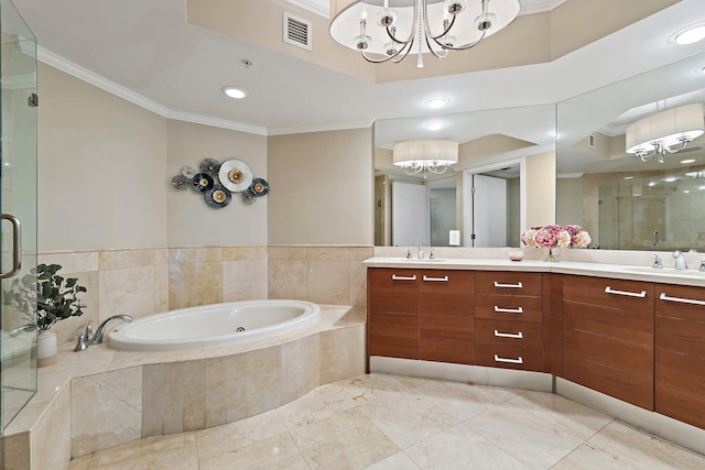 full bath with a sink, ornamental molding, a chandelier, a shower stall, and double vanity