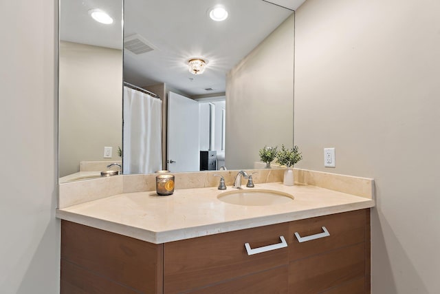 bathroom featuring vanity and visible vents