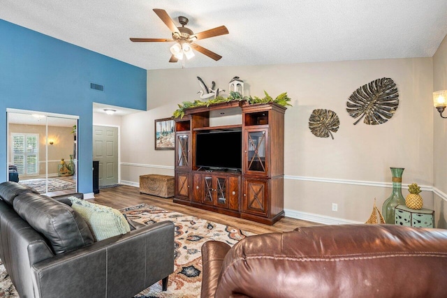 648 Deer Creek Edgewater Dr, Deerfield Beach, FL 33442 - living room featuring baseboards, a ceiling fan, wood finished floors, and lofted ceiling