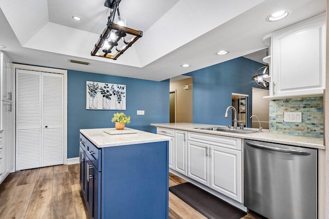 648 Deer Creek Edgewater Dr, Deerfield Beach, FL 33442 - kitchen with a sink, white cabinets, stainless steel dishwasher, and visible vents