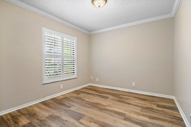 648 Deer Creek Edgewater Dr, Deerfield Beach, FL 33442 - unfurnished room featuring a textured ceiling, ornamental molding, baseboards, and wood finished floors