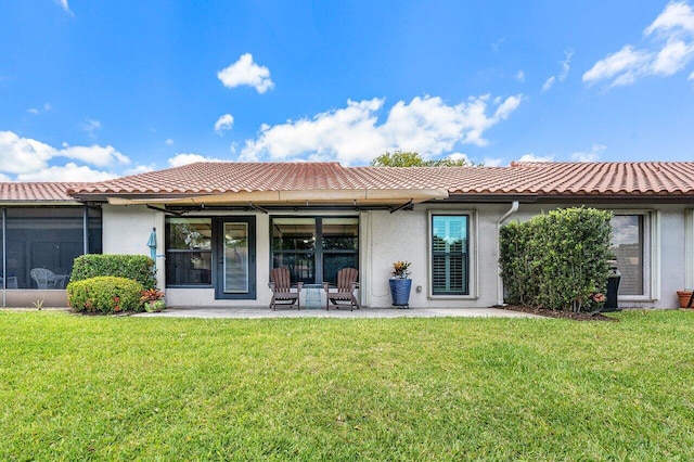 648 Deer Creek Edgewater Dr, Deerfield Beach, FL 33442 - back of house with a lawn, a tile roof, and stucco siding