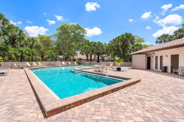 648 Deer Creek Edgewater Dr, Deerfield Beach, FL 33442 - community pool featuring fence and a patio area