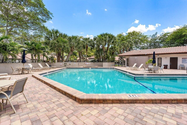 648 Deer Creek Edgewater Dr, Deerfield Beach, FL 33442 - pool featuring a patio and fence