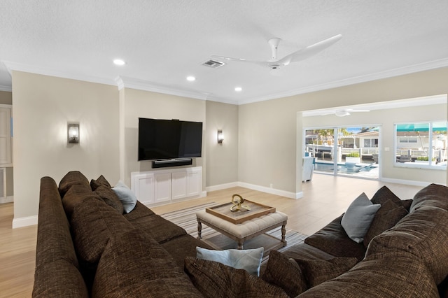 living room with ceiling fan, baseboards, ornamental molding, light wood-style flooring, and recessed lighting