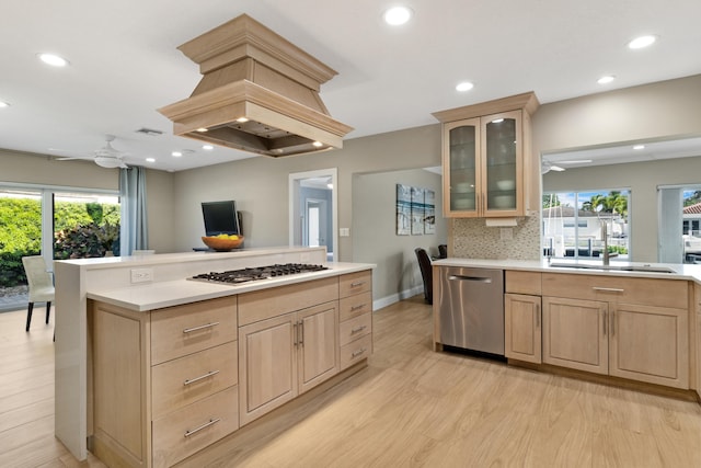 kitchen featuring a ceiling fan, appliances with stainless steel finishes, light brown cabinets, and recessed lighting