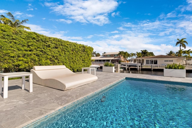 swimming pool featuring a patio