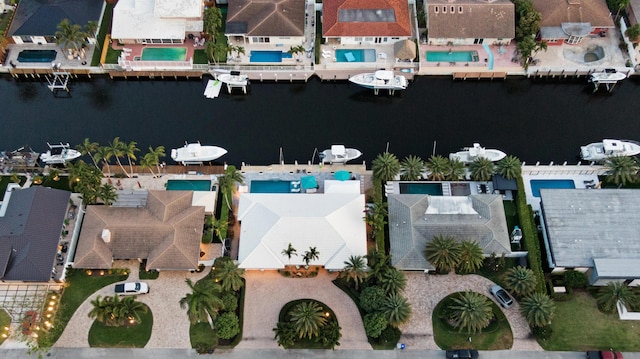aerial view of residential area featuring a nearby body of water
