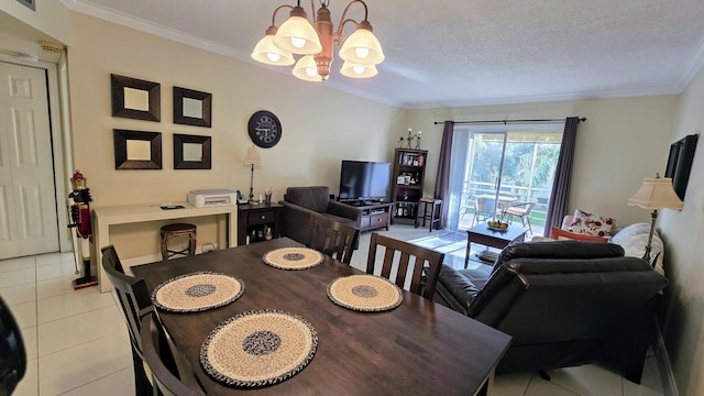 dining room with an inviting chandelier, light tile patterned floors, crown molding, and a textured ceiling