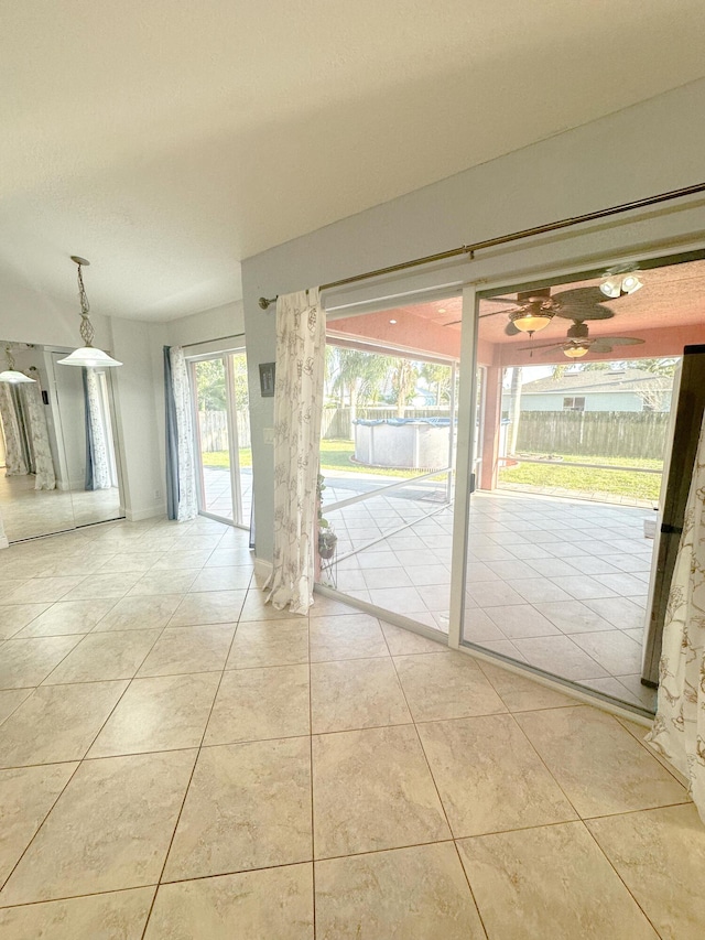 unfurnished room with light tile patterned floors