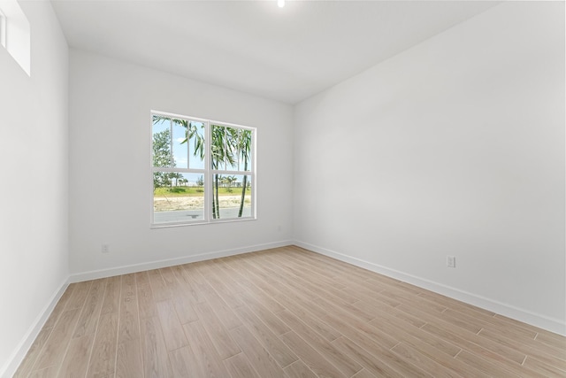 10241 SW Carnelian St, Port Saint Lucie, FL 34987 - unfurnished room featuring baseboards and light wood-style flooring