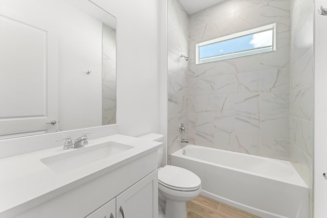 10241 SW Carnelian St, Port Saint Lucie, FL 34987 - bathroom featuring toilet, wood finish floors, shower / tub combination, and vanity