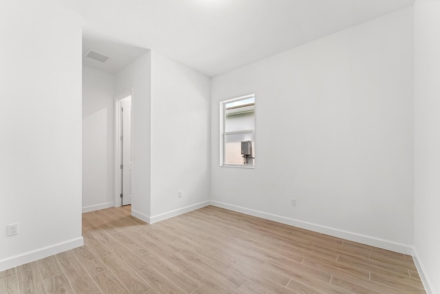 10241 SW Carnelian St, Port Saint Lucie, FL 34987 - unfurnished room with light wood-style floors and baseboards