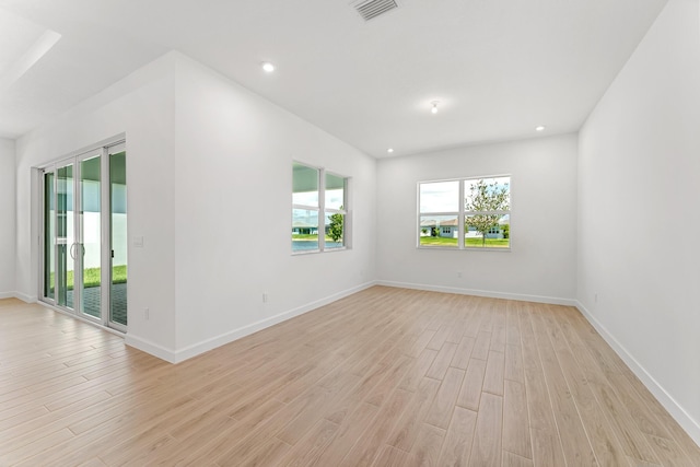 10241 SW Carnelian St, Port Saint Lucie, FL 34987 - spare room with visible vents, recessed lighting, baseboards, and light wood-type flooring