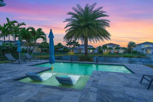 6940 NW 25th Way, Boca Raton, FL 33496 - view of pool with a patio area, fence, and a water view
