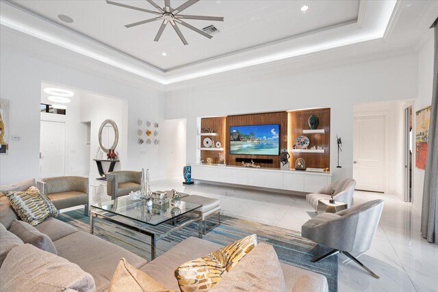6940 NW 25th Way, Boca Raton, FL 33496 - living area with a raised ceiling, ornamental molding, a towering ceiling, and recessed lighting