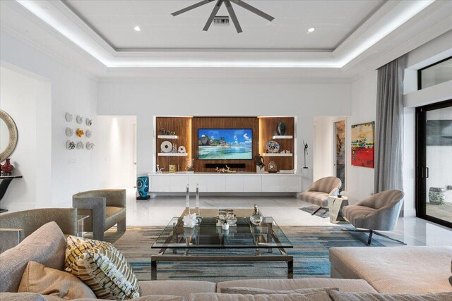 6940 NW 25th Way, Boca Raton, FL 33496 - living room with a towering ceiling, a tray ceiling, a ceiling fan, ornamental molding, and recessed lighting