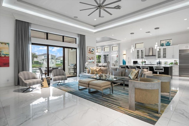6940 NW 25th Way, Boca Raton, FL 33496 - living room with marble finish flooring, a raised ceiling, a high ceiling, crown molding, and ceiling fan