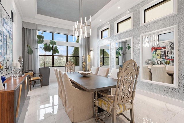 6940 NW 25th Way, Boca Raton, FL 33496 - dining space with crown molding, healthy amount of natural light, light marble finish flooring, and a chandelier