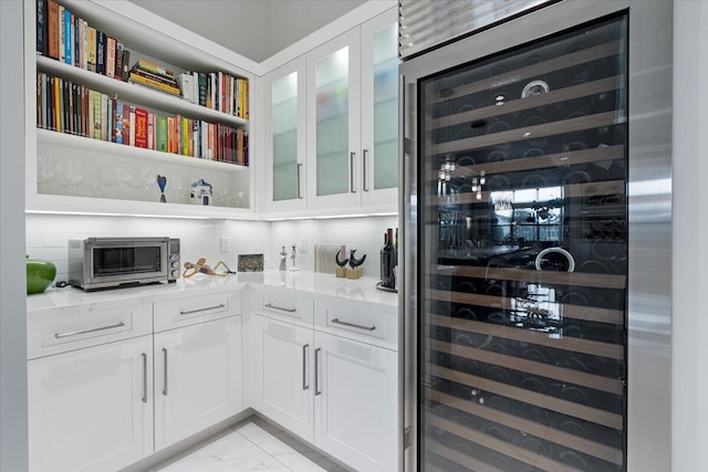 6940 NW 25th Way, Boca Raton, FL 33496 - bar area with wine cooler, light marble finish floors, and decorative backsplash