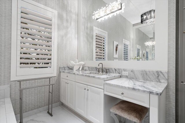 6940 NW 25th Way, Boca Raton, FL 33496 - bathroom featuring a chandelier, marble look tiles, and vanity