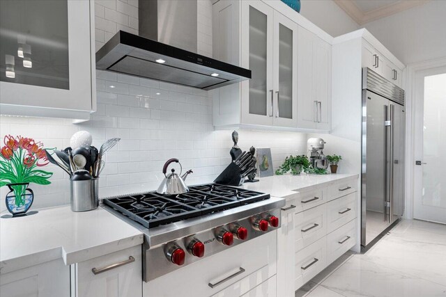 6940 NW 25th Way, Boca Raton, FL 33496 - kitchen featuring wall chimney range hood, appliances with stainless steel finishes, white cabinets, backsplash, and ornamental molding
