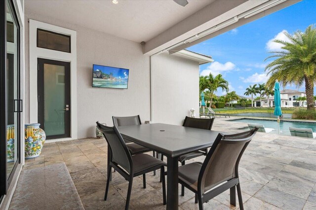 6940 NW 25th Way, Boca Raton, FL 33496 - view of patio with an outdoor pool, outdoor dining space, and ceiling fan