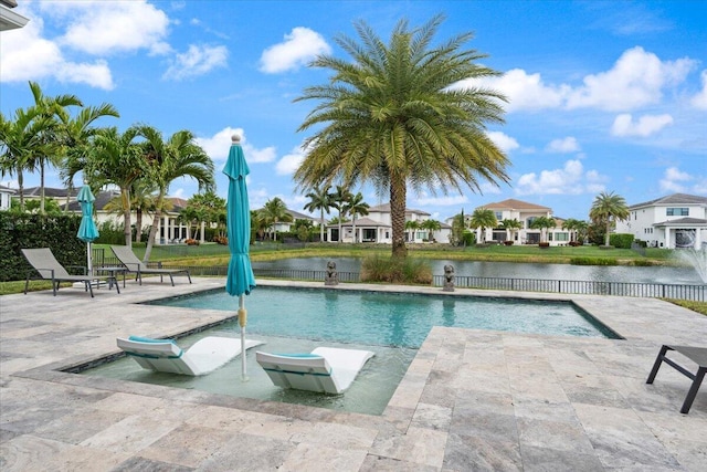 6940 NW 25th Way, Boca Raton, FL 33496 - view of swimming pool with fence, a residential view, a patio, and a water view