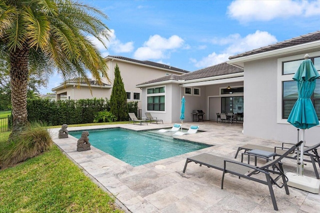 6940 NW 25th Way, Boca Raton, FL 33496 - view of swimming pool with grilling area, a patio, and fence