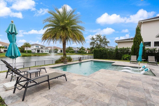 6940 NW 25th Way, Boca Raton, FL 33496 - view of swimming pool with a patio area, fence, a water view, and a residential view