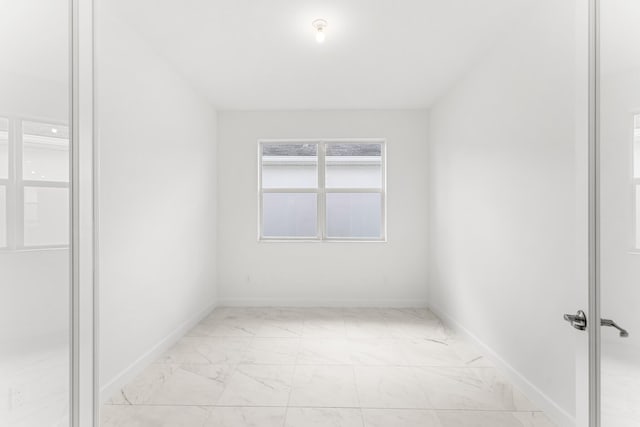 10128 SW Carnelian St, Port Saint Lucie, FL 34987 - unfurnished room featuring baseboards and marble finish floor