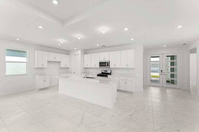 10128 SW Carnelian St, Port Saint Lucie, FL 34987 - kitchen with baseboards, appliances with stainless steel finishes, and a healthy amount of sunlight