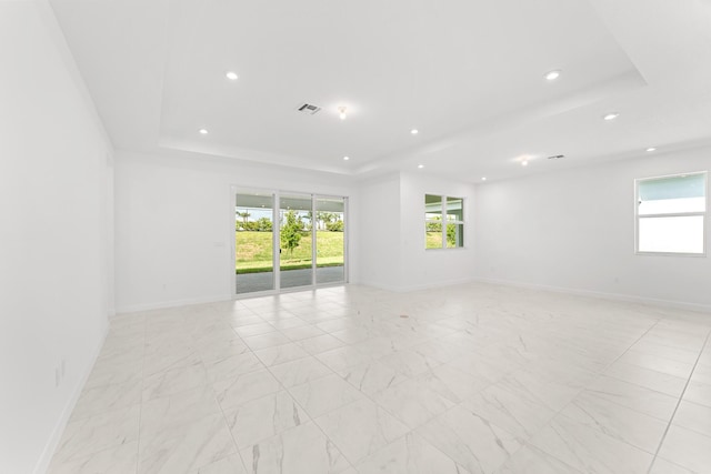 10128 SW Carnelian St, Port Saint Lucie, FL 34987 - empty room featuring recessed lighting, a tray ceiling, visible vents, and baseboards